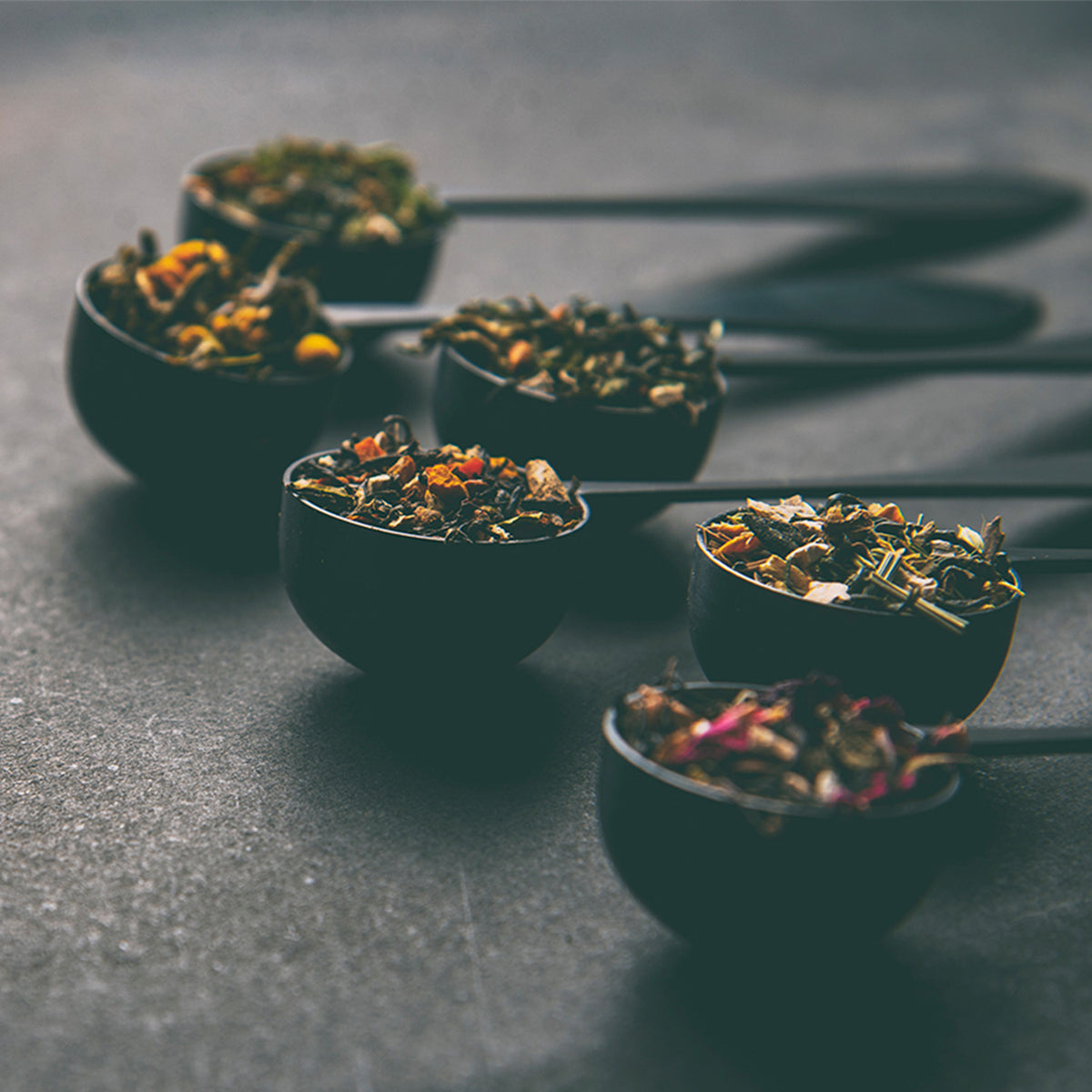 Ideal tea spoons with different loose-leaf teas