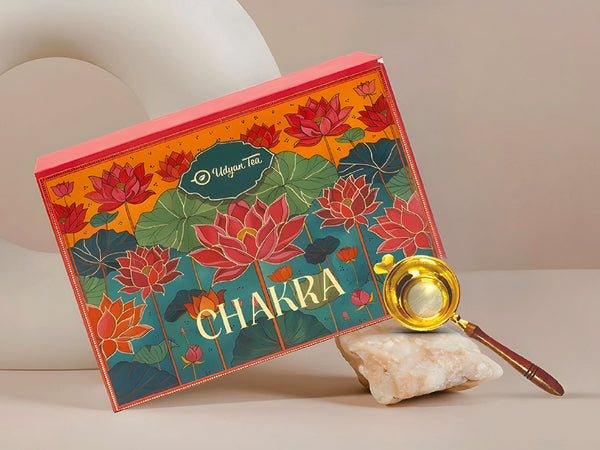 Luxury tea gift box pairing whole leaf teas with a brass strainer