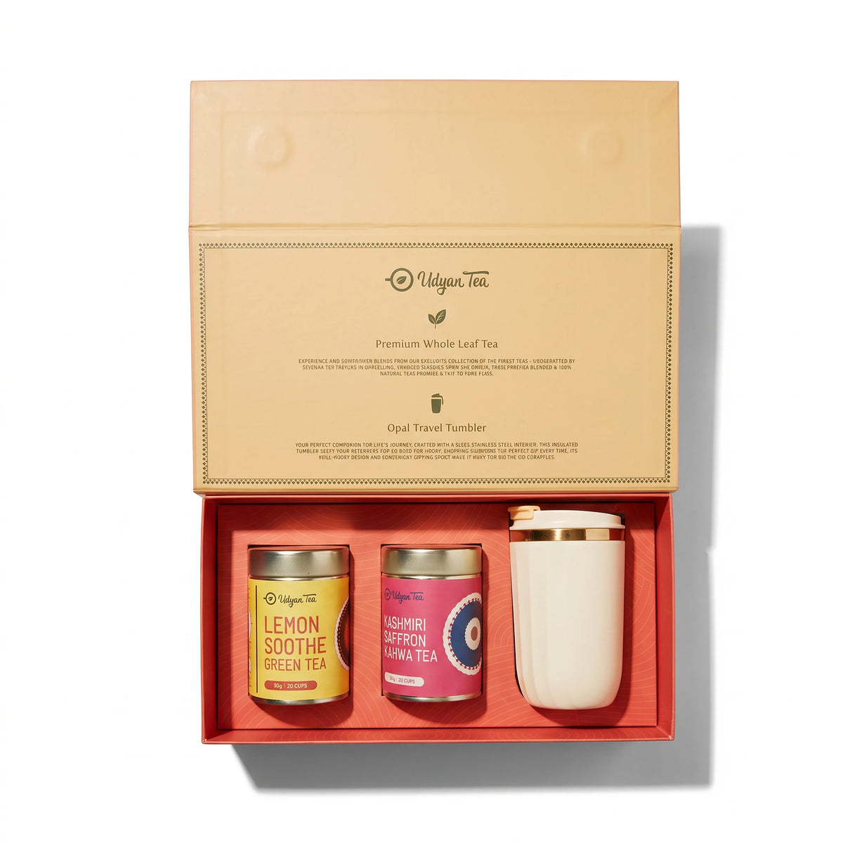 Oasis gift box open, with two tins of tea and an Opal travel tumbler