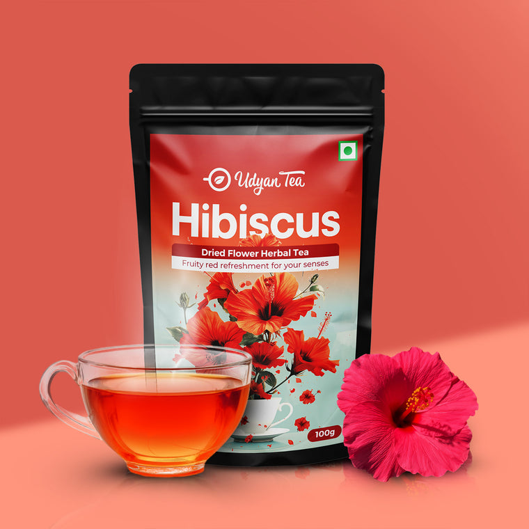 Hibiscus Pure Herbal Tea pouch with a cup of brewed tea and hibiscus flower