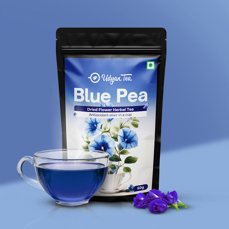 Blue Pea Pure Herbal Tea pouch with a cup of brewed blue tea