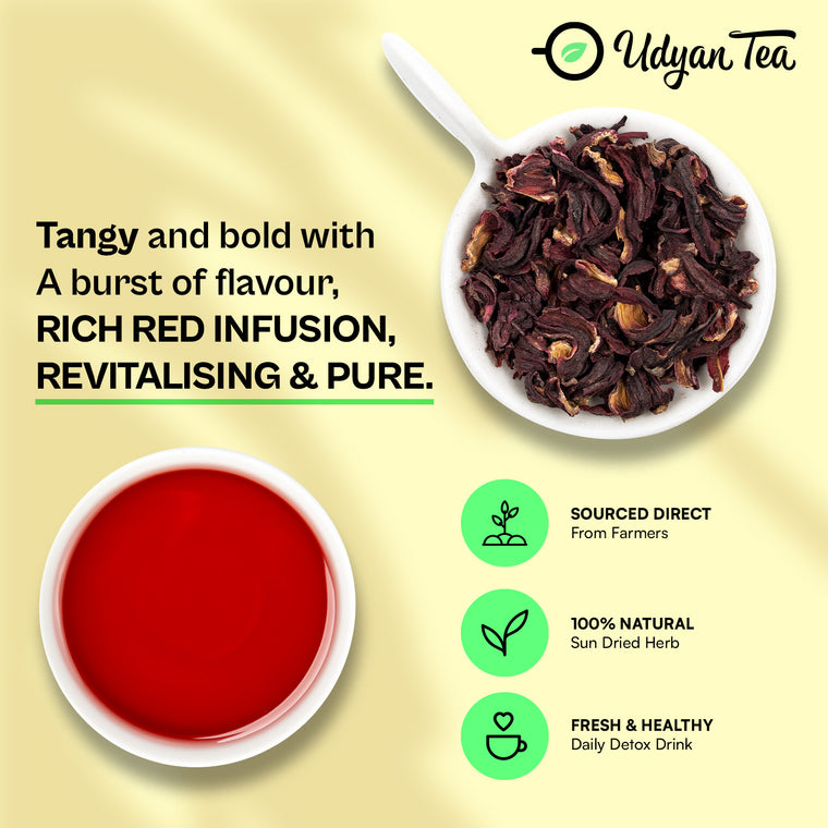 Dried hibiscus flowers and a cup of brewed hibiscus tea