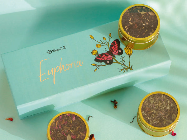 Tea gift box holding three whole leaf teas in caddies