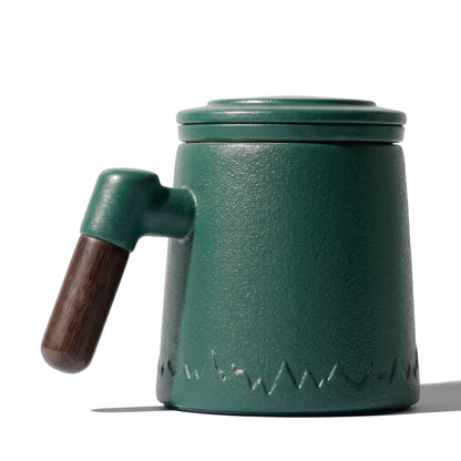 Everest ceramic tea infuser mug, Forest Green, on a white background