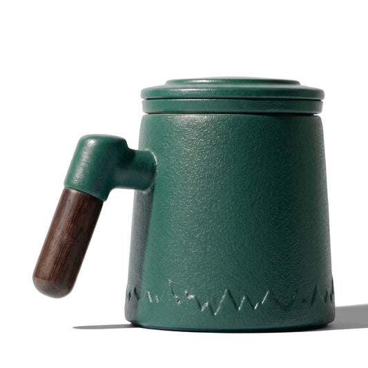 Everest ceramic tea infuser mug, Forest Green, on a white background