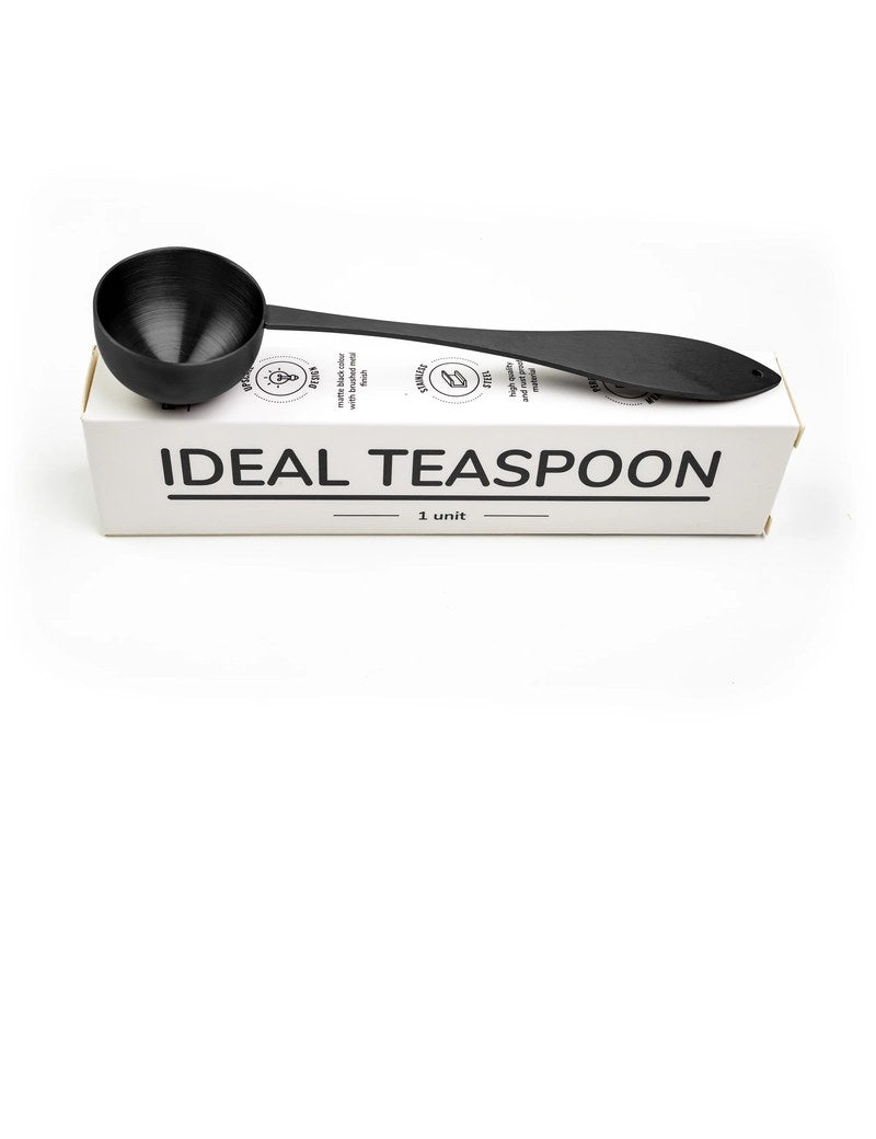 Ideal tea spoon, matte black, resting on its box