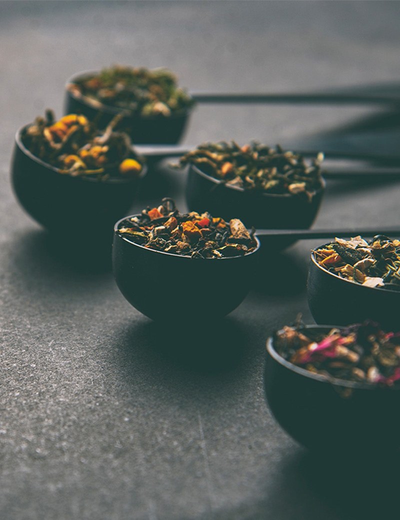 Ideal tea spoons holding different loose-leaf teas