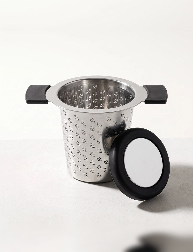 Perfect tea infuser with the lid beside it