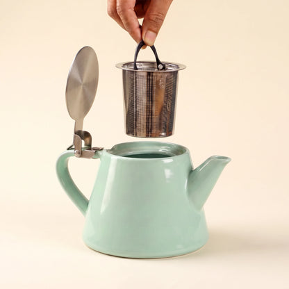 Muse ceramic teapot with infuser, Aqua Blue, infuser being lifted out of the teapot