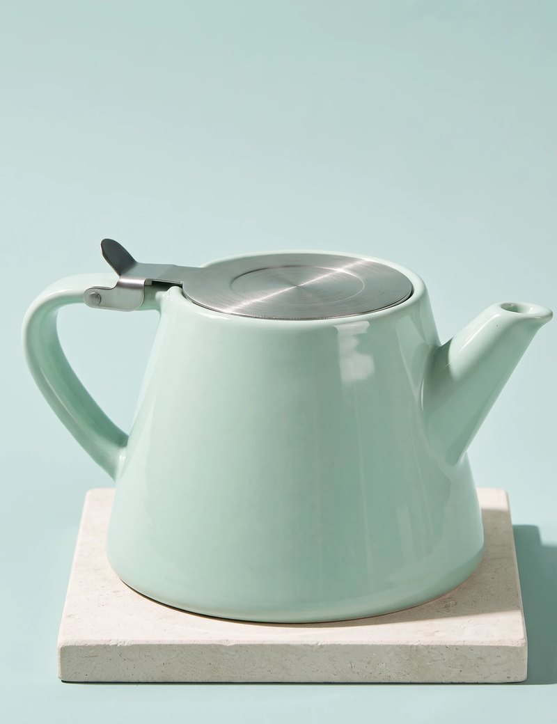 Muse teapot, Aqua Blue, on a stone tile
