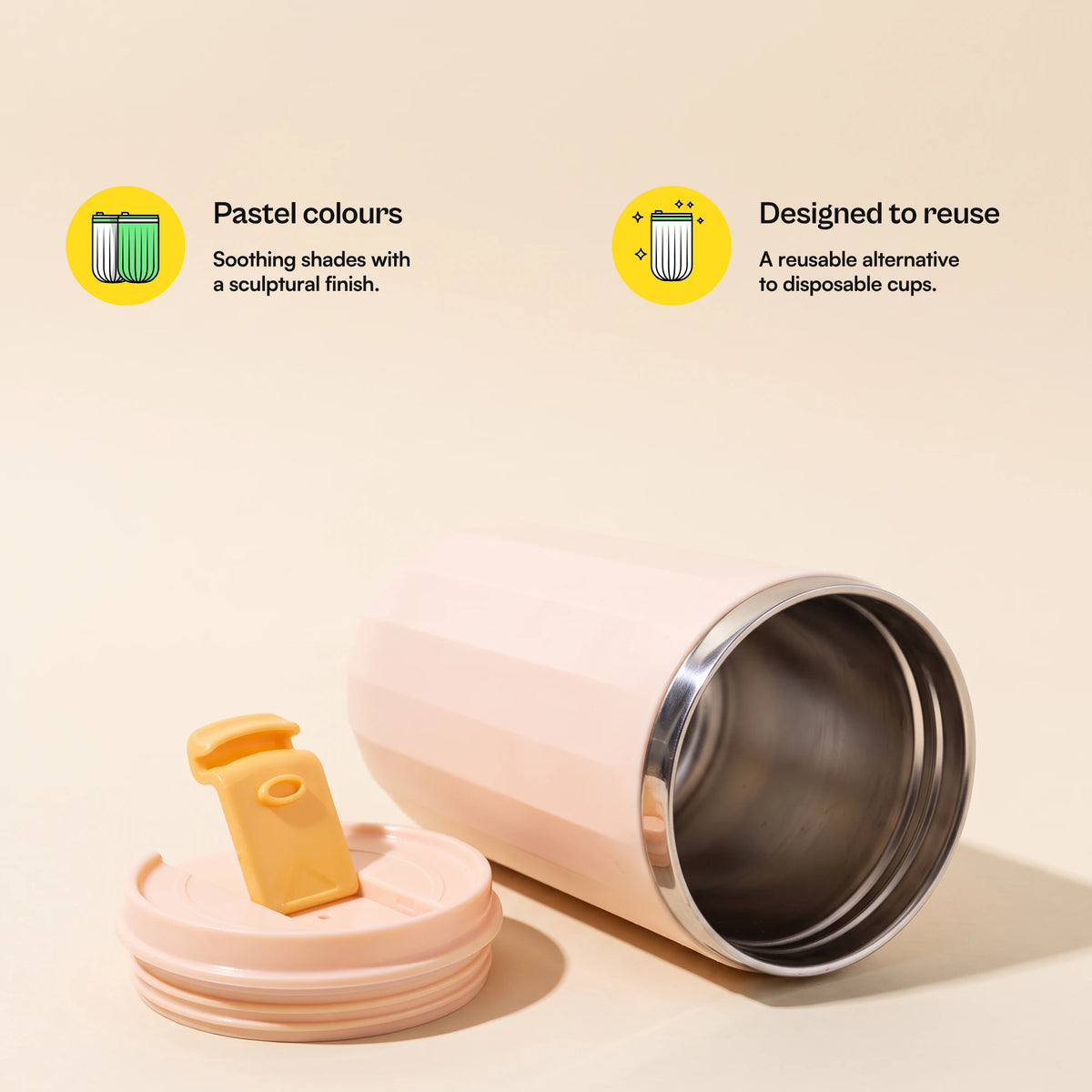 Opal travel tumbler, Blush Pink, lid off, lying on its side, with more feature callouts