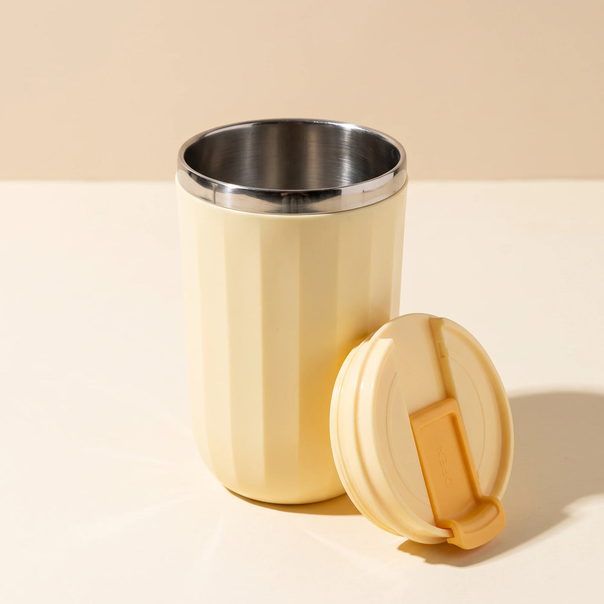Opal travel tumbler, Honey Yellow, lid off, stainless steel inside
