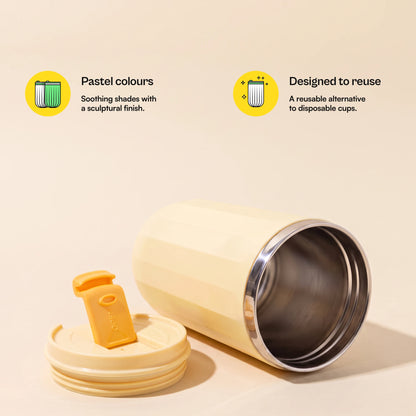 Opal travel tumbler, Honey Yellow, lid off, lying on its side, with more feature callouts