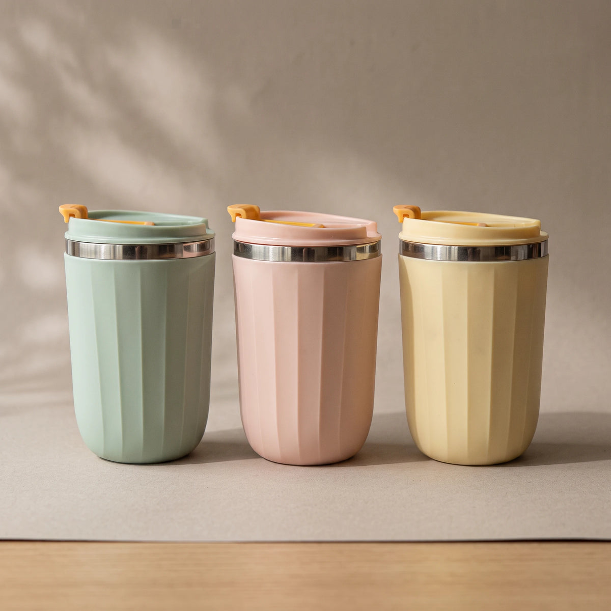 Opal travel tumblers in Sage Green, Blush Pink and Honey Yellow, side by side