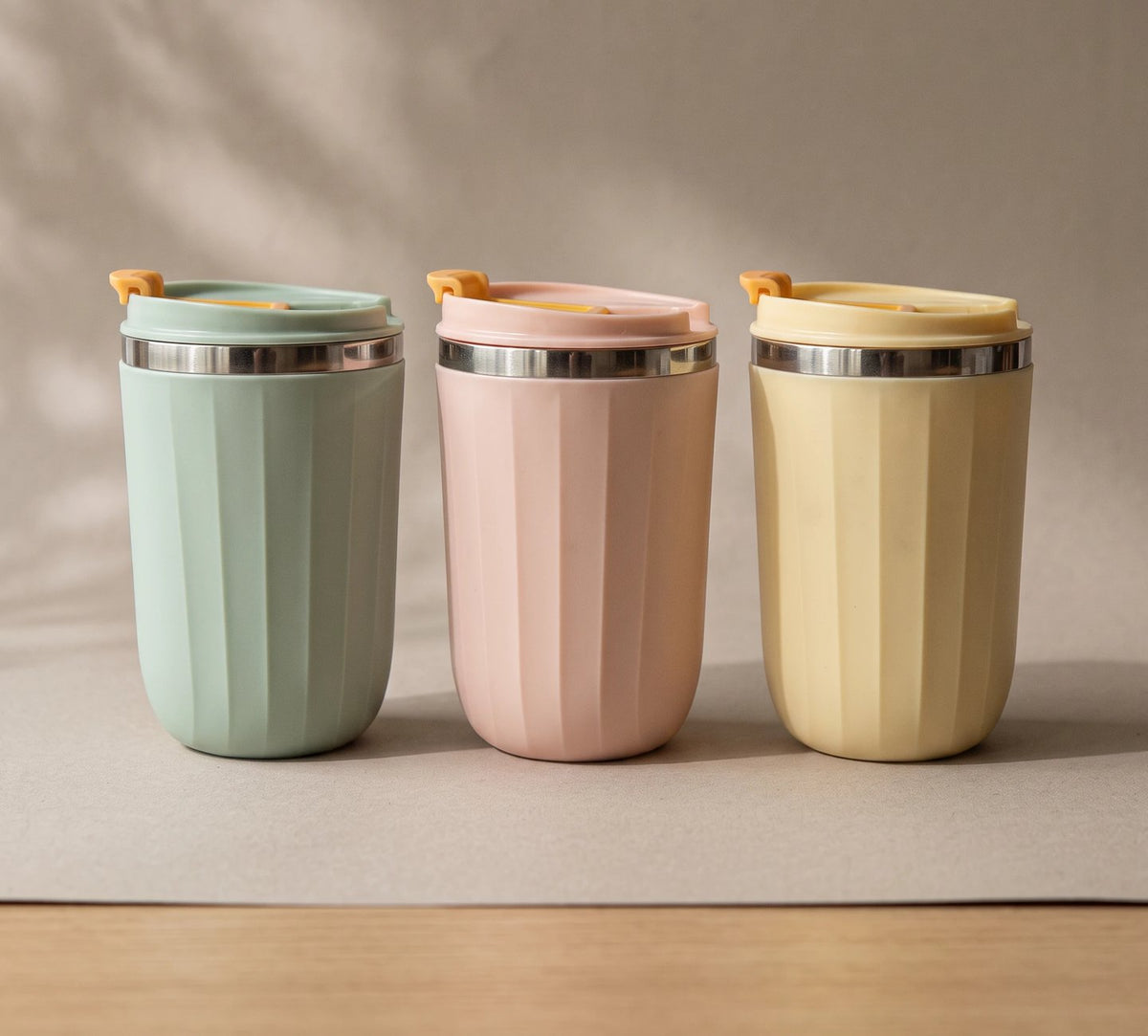 Opal travel tumblers in Sage Green, Blush Pink and Honey Yellow, side by side