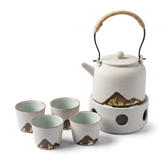 Pinnacle ceramic tea set: teapot on its warmer with 4 cups