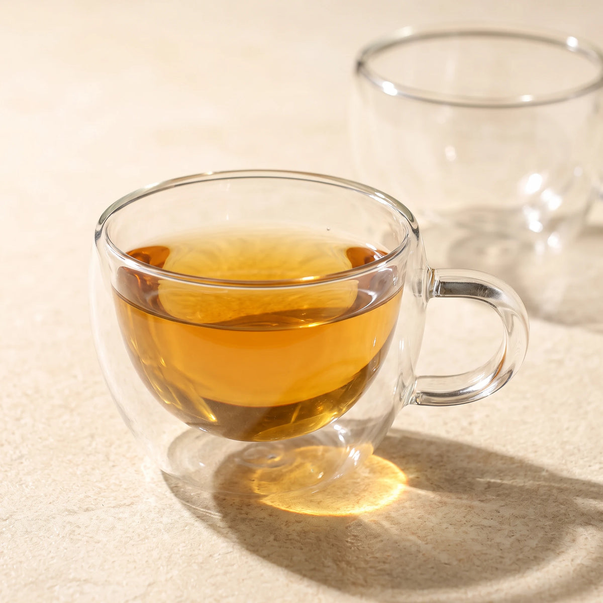 Stellar double wall glass tea cups, with tea, close-up of the double wall