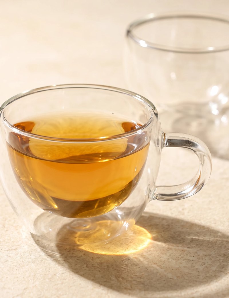 Stellar double wall glass tea cup with tea, close-up of the double wall